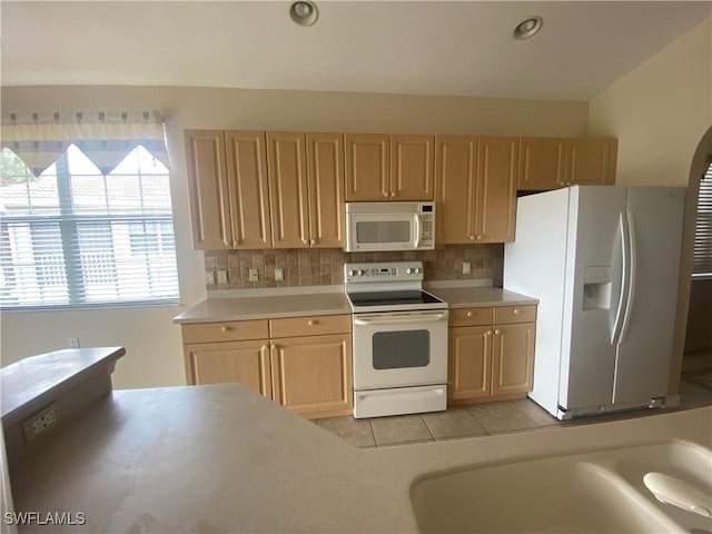 3054 Driftwood Way Unit 4508, Naples, FL 34109 - kitchen with white appliances, light brown cabinetry, tasteful backsplash, and light countertops