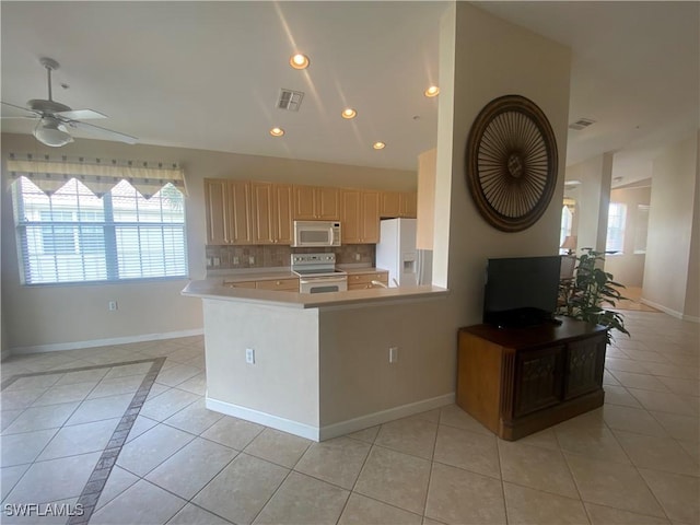 3054 Driftwood Way Unit 4508, Naples, FL 34109 - kitchen featuring white appliances, a ceiling fan, light countertops, tasteful backsplash, and recessed lighting