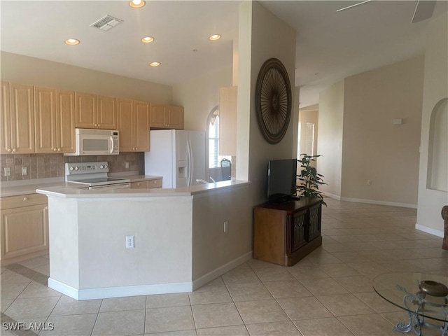3054 Driftwood Way Unit 4508, Naples, FL 34109 - kitchen featuring white appliances, light tile patterned floors, decorative backsplash, light countertops, and light brown cabinetry