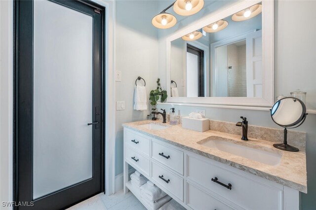 bathroom with vanity and tile patterned flooring