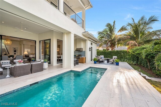 view of pool featuring area for grilling, an outdoor living space, a patio, and ceiling fan