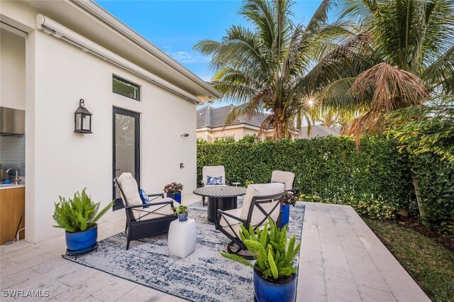 view of patio featuring sink and outdoor lounge area