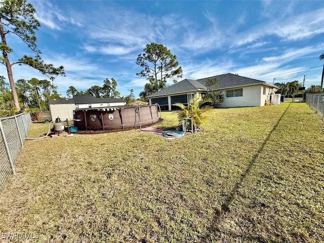 rear view of house with a lawn