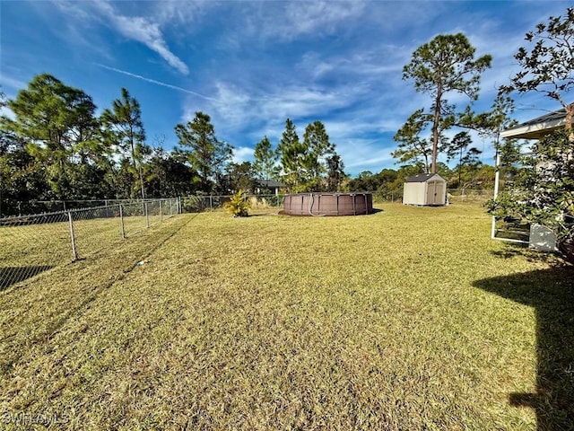 view of yard with a storage shed