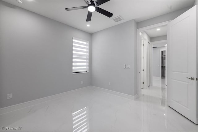 unfurnished room with ceiling fan