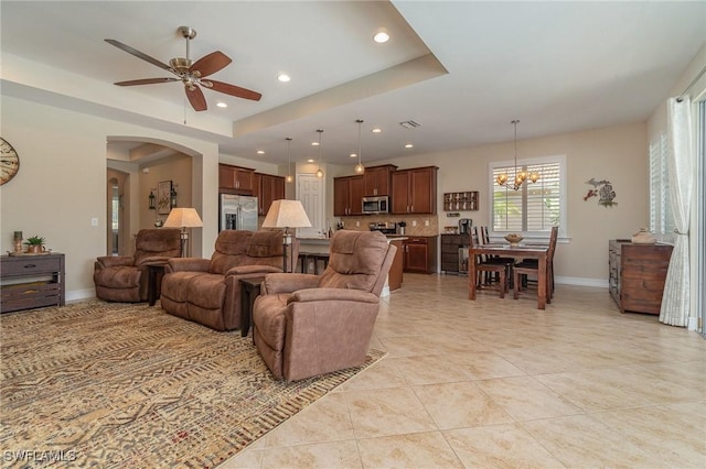 3200 Magnolia Landing Ln, North Fort Myers, FL 33917 - living room featuring a ceiling fan, recessed lighting, a chandelier, a raised ceiling, and light tile patterned floors