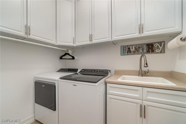 3200 Magnolia Landing Ln, North Fort Myers, FL 33917 - laundry room featuring washer and clothes dryer and cabinet space