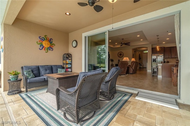 view of patio / terrace featuring ceiling fan and an outdoor hangout area