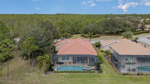 3200 Magnolia Landing Ln, North Fort Myers, FL 33917 - aerial view of property and surrounding area with a forest and a pool