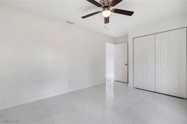 unfurnished bedroom with a closet and ceiling fan