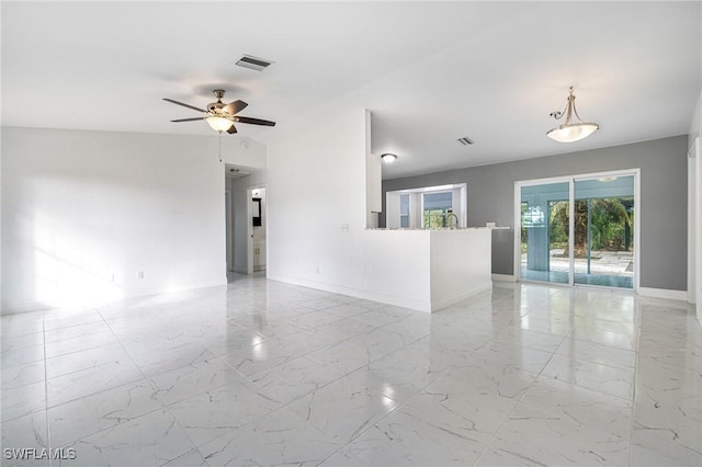 unfurnished room with ceiling fan