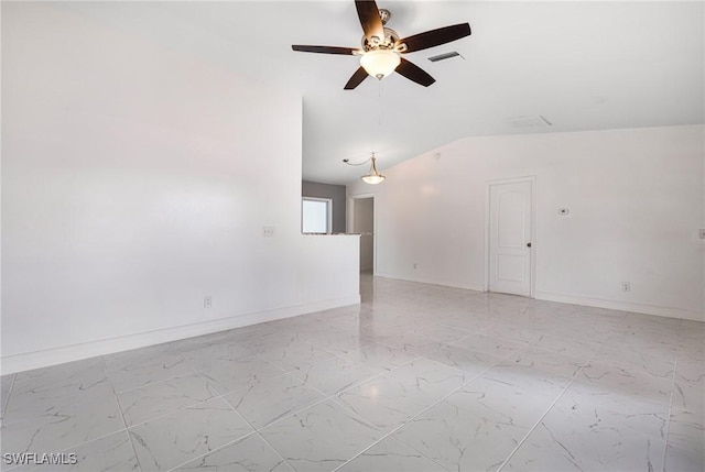 spare room featuring ceiling fan and vaulted ceiling