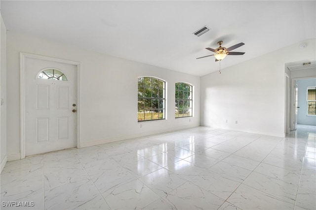 foyer featuring lofted ceiling and ceiling fan