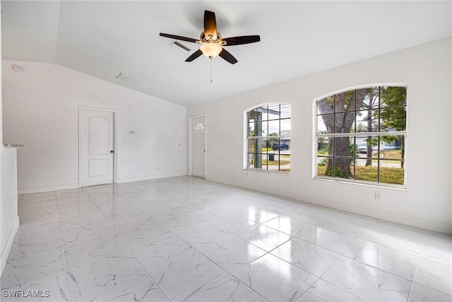 empty room featuring ceiling fan and lofted ceiling