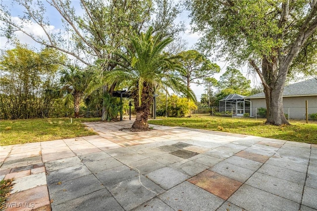 view of patio with glass enclosure