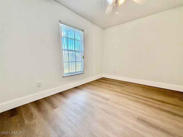 unfurnished room featuring hardwood / wood-style floors and ceiling fan