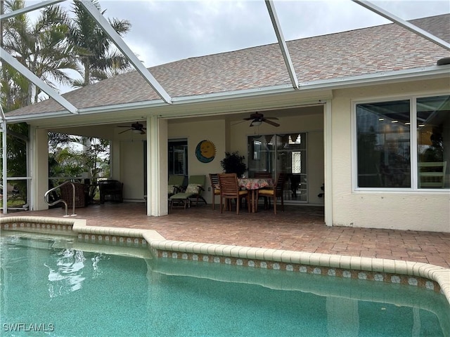 view of swimming pool featuring ceiling fan and a patio