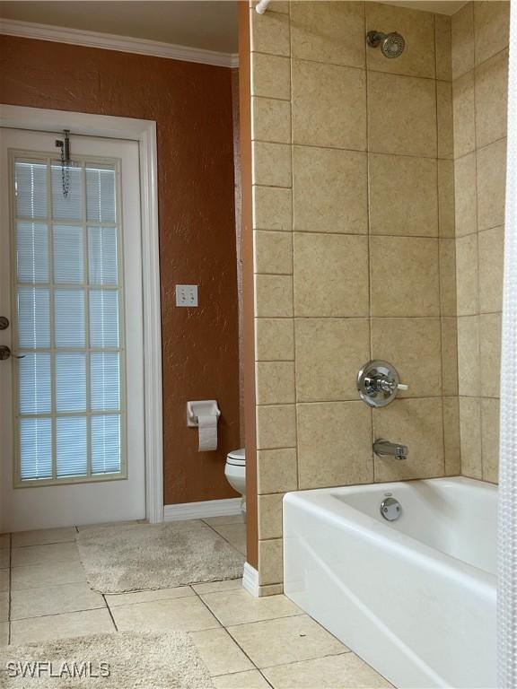 bathroom featuring toilet, crown molding, shower / bathtub combination with curtain, and tile patterned flooring