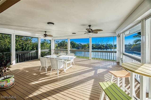 3131 Twin Lakes Ln, Sanibel, FL 33957 - sunroom / solarium featuring a water view, ceiling fan, and outdoor dining area