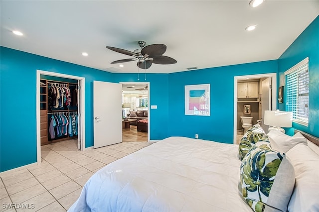 bedroom featuring a closet, ceiling fan, and light tile patterned flooring