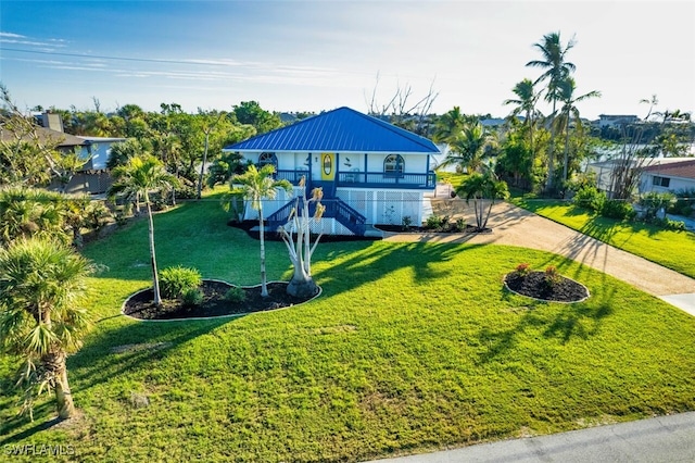 3131 Twin Lakes Ln, Sanibel, FL 33957 - exterior space featuring a lawn and stairway