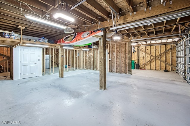 3131 Twin Lakes Ln, Sanibel, FL 33957 - basement with freestanding refrigerator and a garage