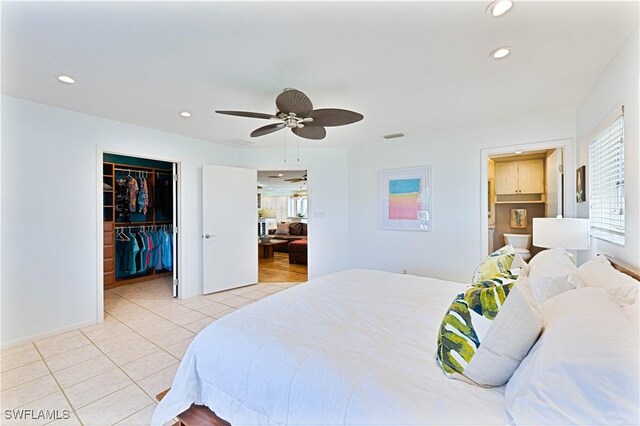 3131 Twin Lakes Ln, Sanibel, FL 33957 - bedroom featuring a closet, recessed lighting, a ceiling fan, light tile patterned flooring, and a walk in closet