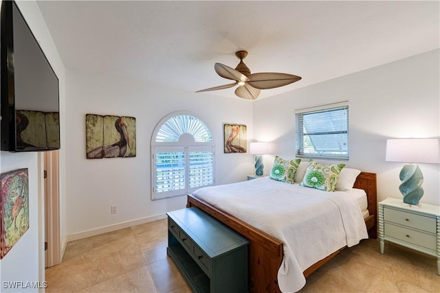 3131 Twin Lakes Ln, Sanibel, FL 33957 - bedroom with ceiling fan, baseboards, and multiple windows