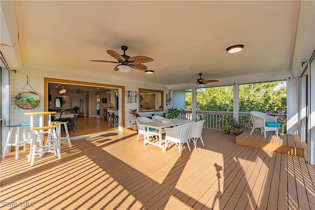 3131 Twin Lakes Ln, Sanibel, FL 33957 - deck featuring outdoor dining space and a ceiling fan