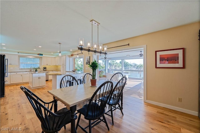 3131 Twin Lakes Ln, Sanibel, FL 33957 - dining room with a wealth of natural light, recessed lighting, light wood finished floors, and baseboards