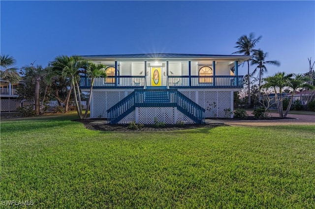 3131 Twin Lakes Ln, Sanibel, FL 33957 - view of front of property with stairs, a porch, and a front yard