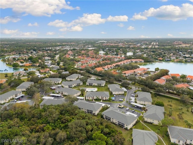 drone / aerial view with a water view