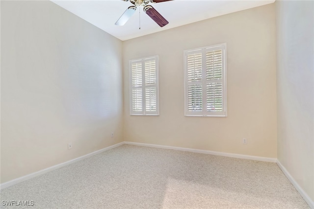 spare room featuring ceiling fan and carpet flooring