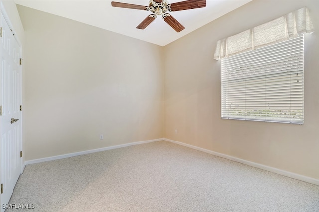 carpeted empty room with ceiling fan