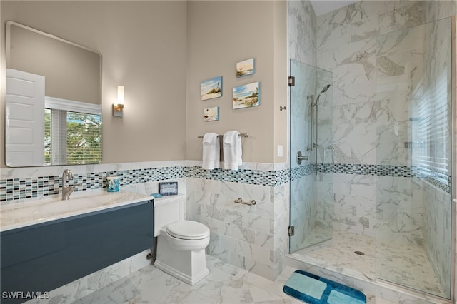 bathroom featuring tile walls, vanity, toilet, and walk in shower