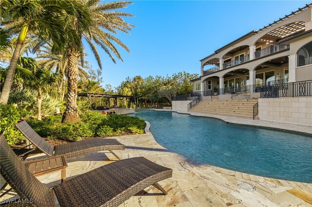 330 Cowry Ct, Sanibel, FL 33957 - view of swimming pool with a patio, stairs, and a fenced in pool