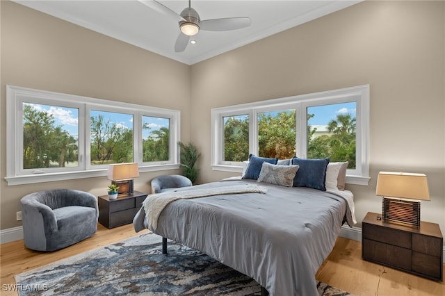 330 Cowry Ct, Sanibel, FL 33957 - bedroom featuring a ceiling fan, baseboards, and wood finished floors