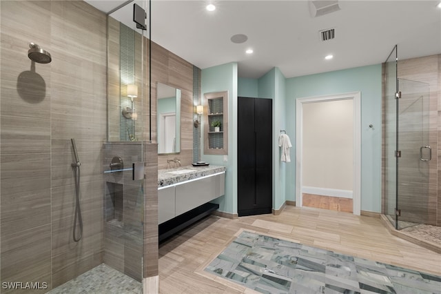 330 Cowry Ct, Sanibel, FL 33957 - full bath with vanity, a shower stall, baseboards, visible vents, and recessed lighting