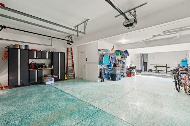 garage featuring a garage door opener