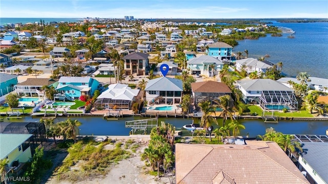 birds eye view of property with a residential view and a water view