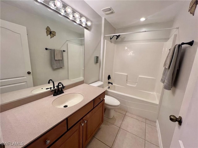 full bathroom with washtub / shower combination, toilet, vanity, and tile patterned flooring