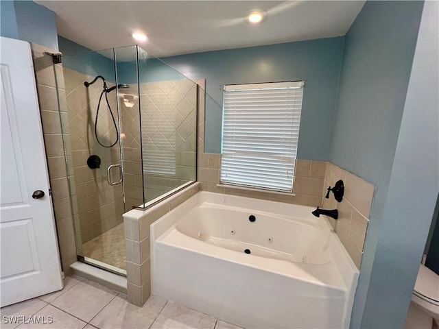 bathroom featuring separate shower and tub and tile patterned flooring