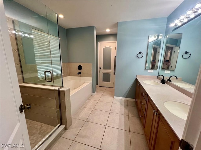 bathroom with plus walk in shower, tile patterned flooring, and vanity