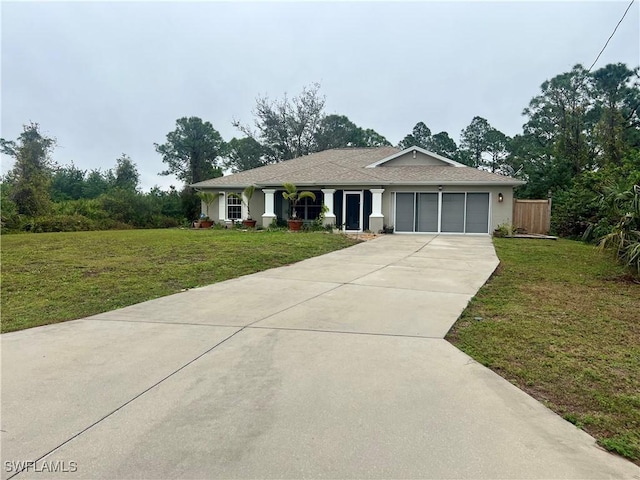 ranch-style house with a garage and a front yard