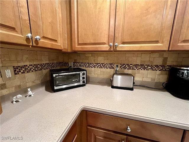 room details featuring decorative backsplash