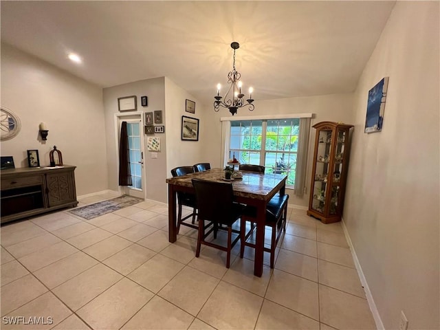 tiled dining area with a notable chandelier