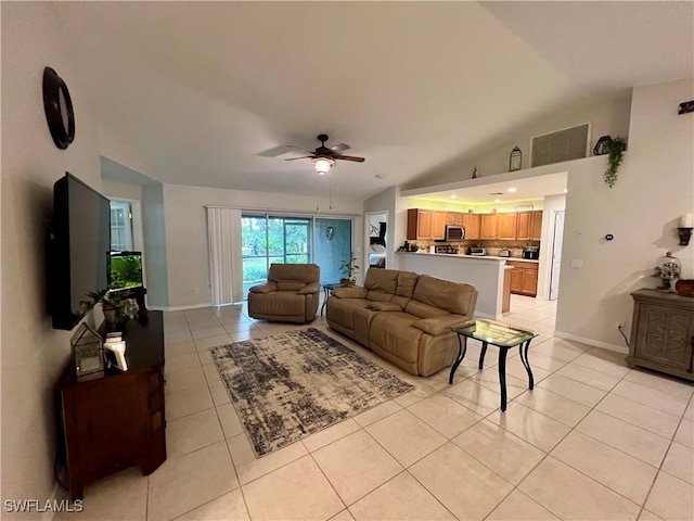 tiled living room with ceiling fan and vaulted ceiling