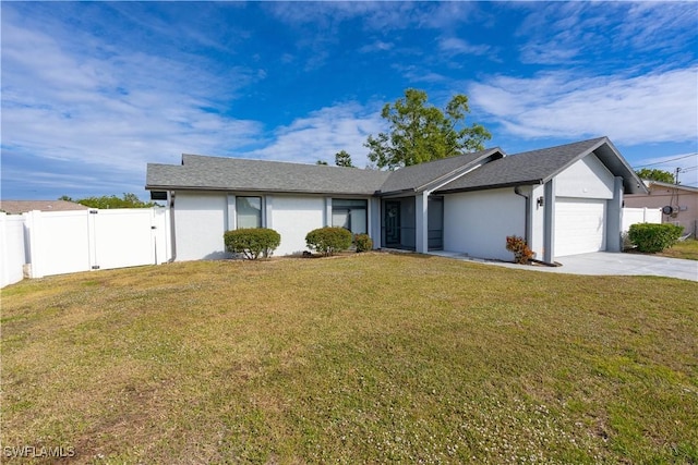 ranch-style home with a front lawn and a garage