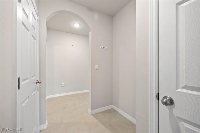 hallway featuring light tile patterned floors