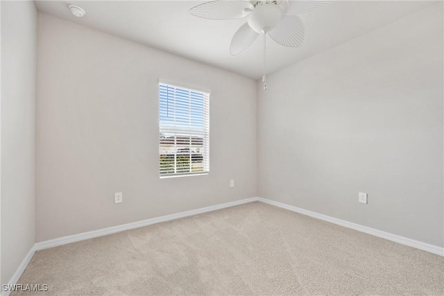 unfurnished room featuring ceiling fan and light colored carpet